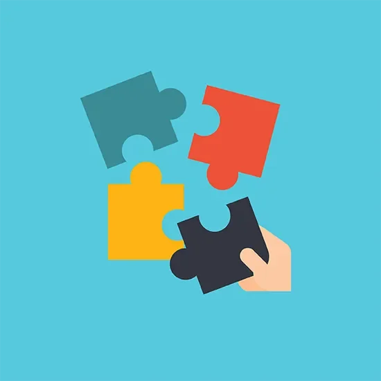 A hand holding a jigsaw piece
