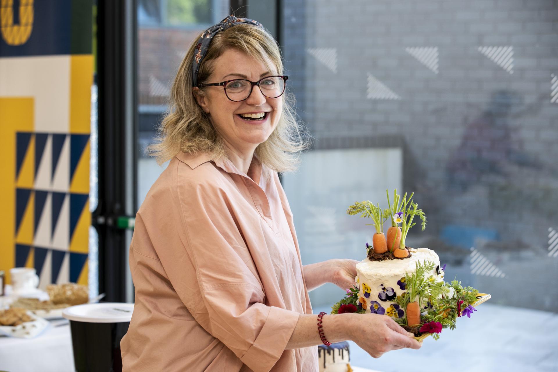 Shows Marcella Bannon with her carrot cake