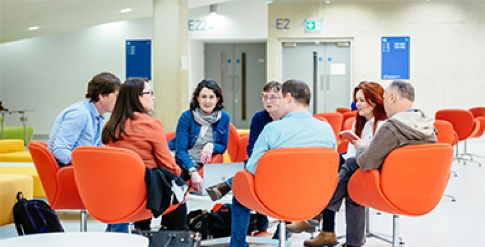 Staff sitting around in a circle