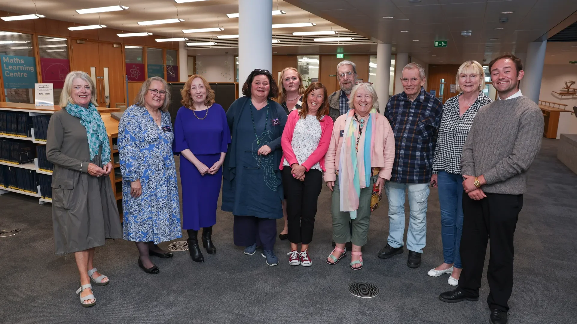 Eleven people facing the camera