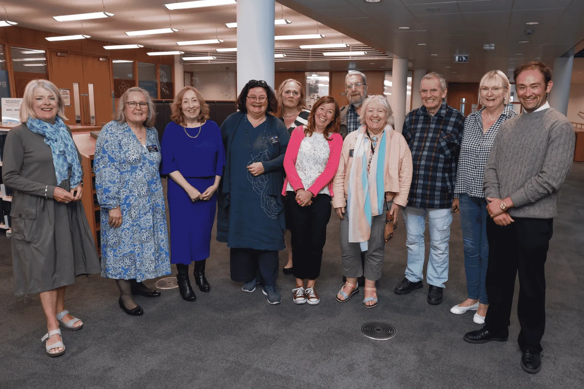 Eleven people facing the camera