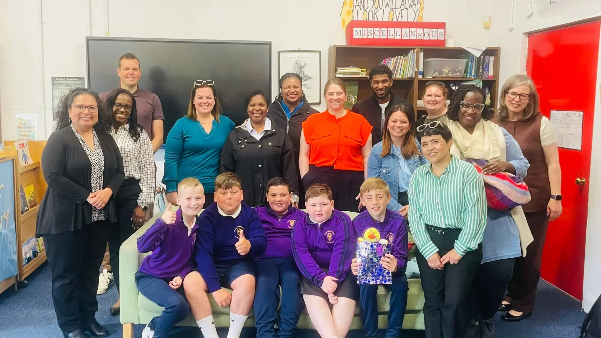Group picture of visitors from Tarleton State University with Principal of Francis Street School and some students.