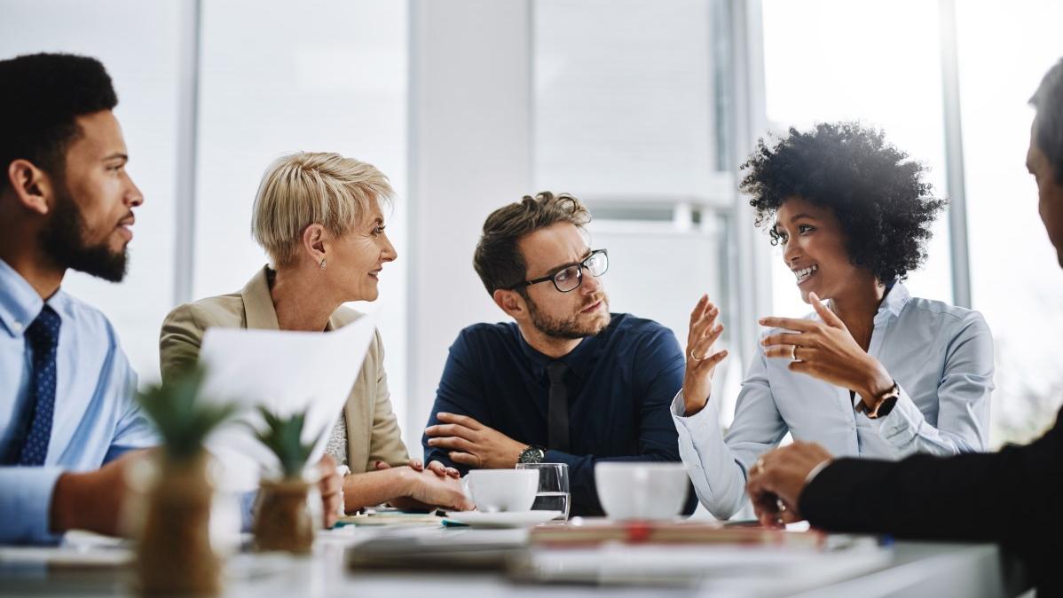 Adults talking at a table